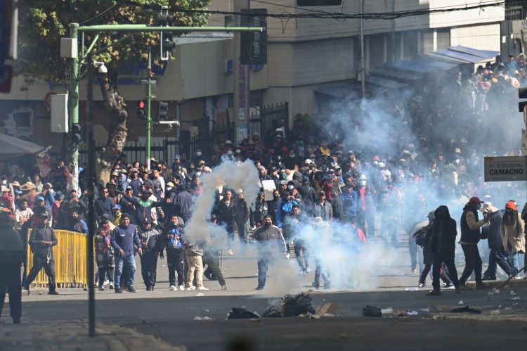 Demonstrators stand on the street as they clash with police on the day of a march calling for the resignation of Bolivian President Rodrigo Paz, while the country’s economic and fuel crisis worsens due to a shortage of U.S. dollars and declining domestic energy production, in La Paz, Bolivia, May 25, 2026. REUTERS/Claudia Morales